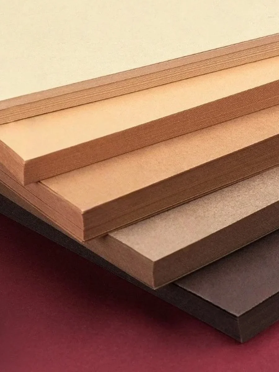 Stacks of premium heavyweight 250GSM cream and tan cardstock paper for handwritten notes, an affordable luxury tool for a sophisticated personal brand.