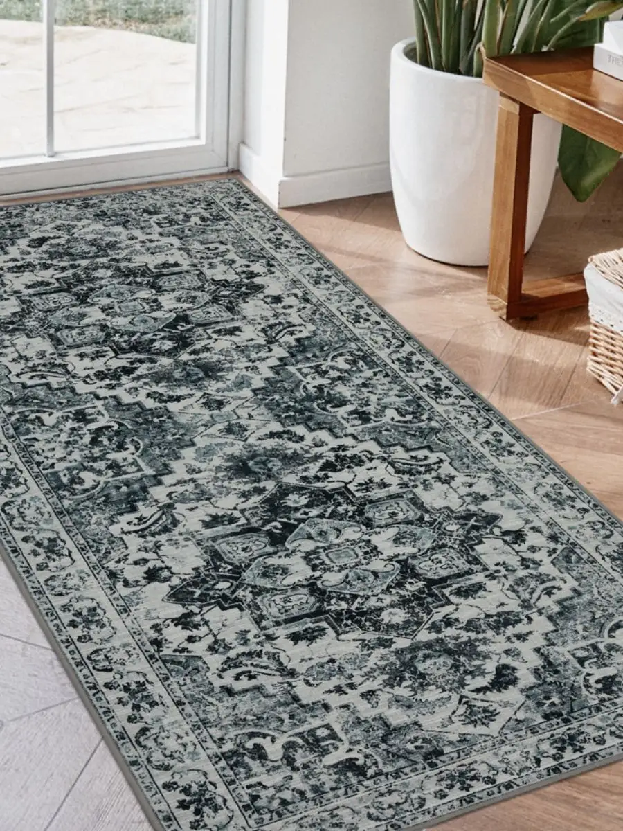 Joydeco grey and white vintage geometric runner rug styled down a long narrow entryway hallway.