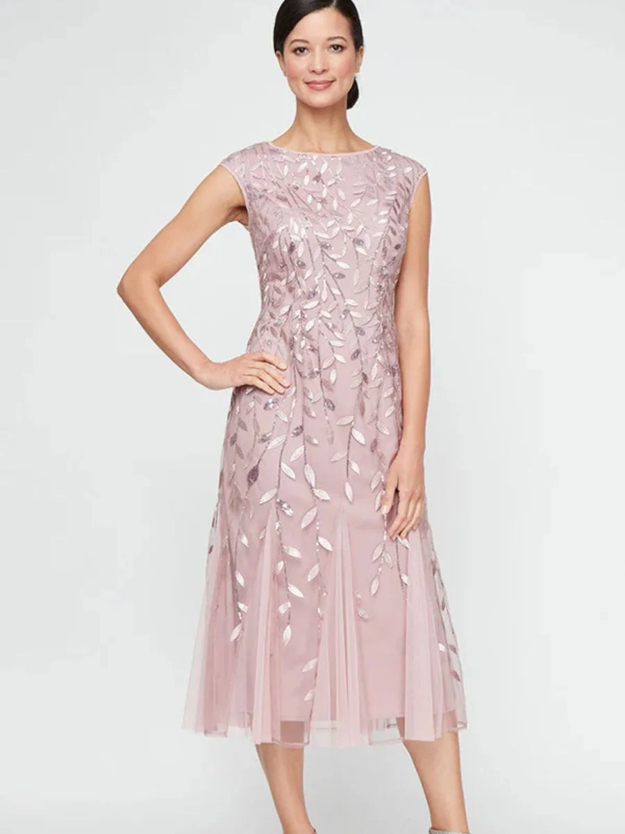 A beautiful Alex Evenings boat neck tea-length embroidered mesh cocktail dress with a graceful godet skirt in an elegant pastel tone.