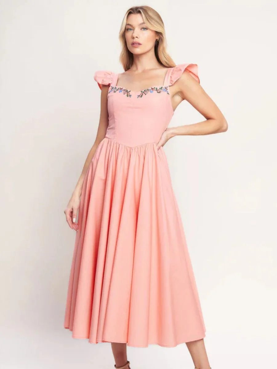 A charming Flying Tomato sweetheart neckline flutter cap sleeve embroidered midi dress in an elegant soft pink hue.