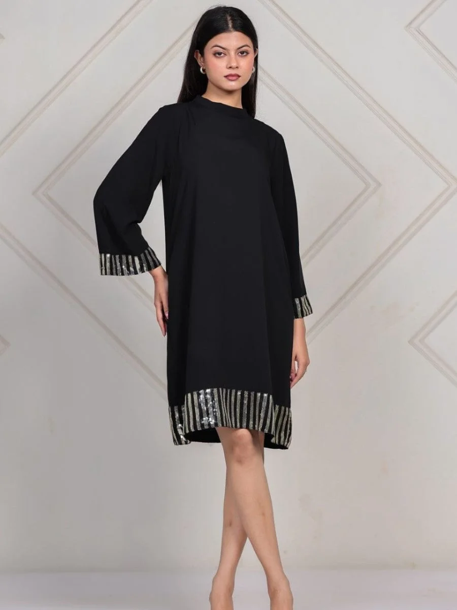 An elegant midnight black modal tunic dress featuring a high mock-neck and vertical metallic sequin trim.
