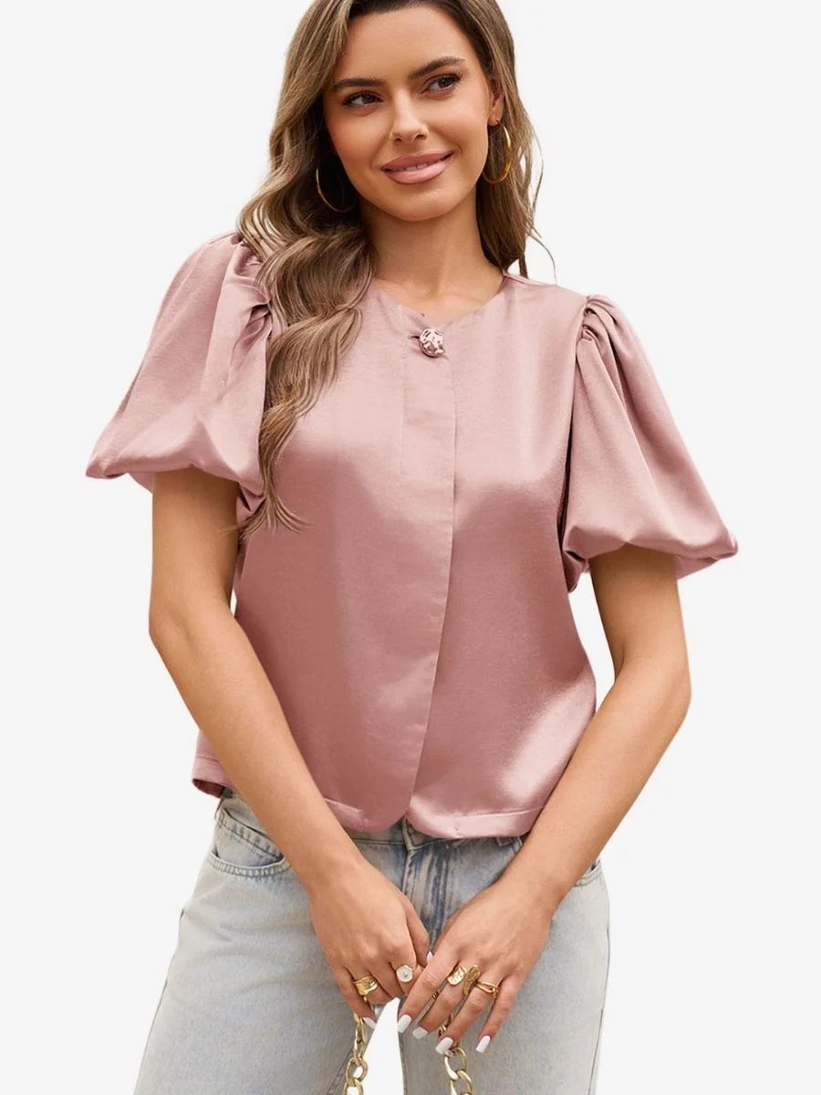 Cicy Bell dusty rose silk satin balloon sleeve blouse with covered button placket on a model