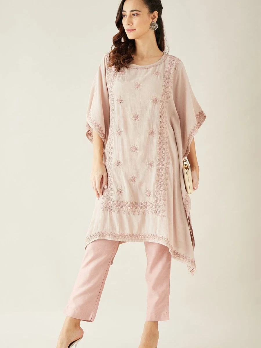  A two-piece pastel pink modal kaftan set featuring delicate white hand-embroidery along the yoke and hem.