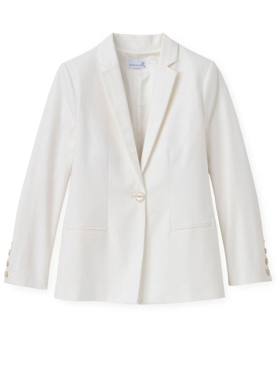 Isolated soft white linen blazer demonstrating sharp tailoring and pocket placement for a monochromatic all white outfit.