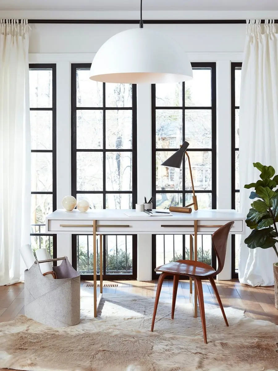 Old Money Home Decor: Easy Styling Steps to Make an Average Room Look High-End Regina Andrew Andres grey hair on hide storage basket filled with architectural blueprint rolls in a bright modern home office. Luxury storage ideas for a high-end interior.