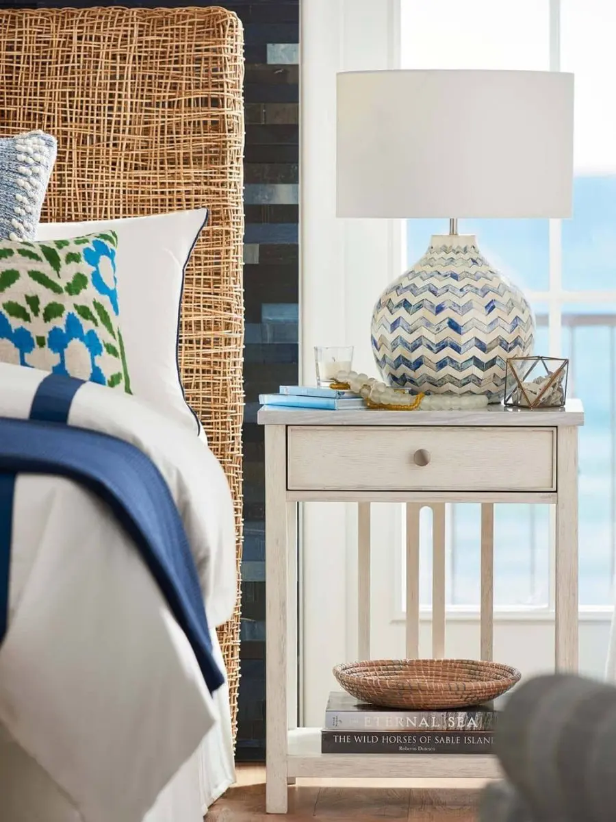 7 Layered Lighting Looks: How to Style Elegant Wall Sconces and Lamps Regina Andrew Chevron Bone Table Lamp with blue and white pattern on a nightstand in a coastal bedroom layout.