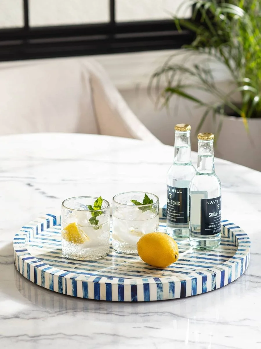 Old Money Home Decor: Easy Styling Steps to Make an Average Room Look High-End Old money home decor style round mosaic bone inlay tray with striped blue and white coastal design details.