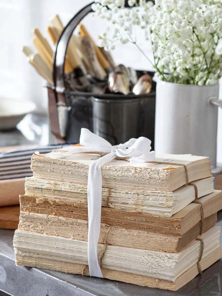 Old Money Home Decor: Easy Styling Steps to Make an Average Room Look High-End The set of six true vintage unbound books tied with jute rope by Regina Andrew.