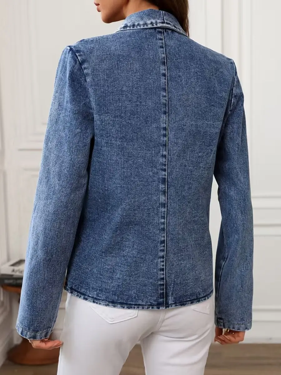 Back view of the blue denim shawl blazer highlighting the structured tailoring seams.