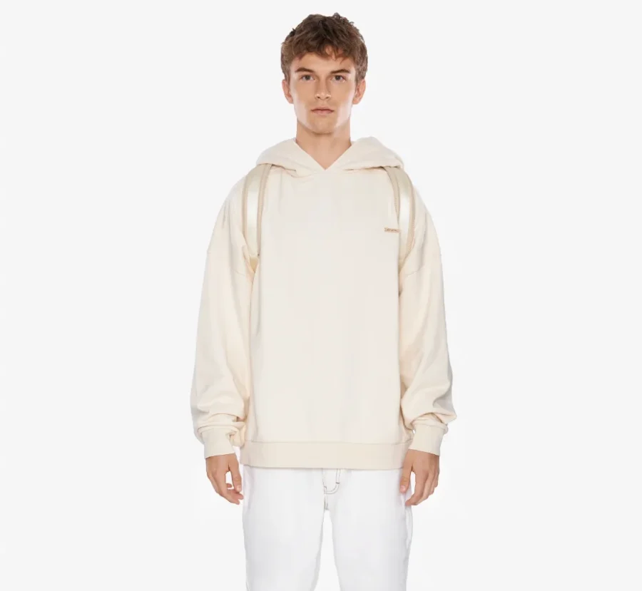 Front view of a man modeling a boxy heavy off-white soft oversized men's hoodie with raw edges.