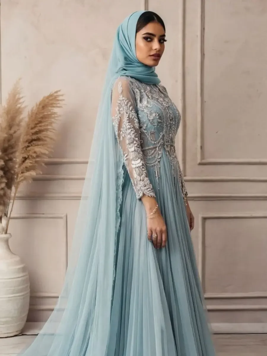 Elegant light blue modest evening gown with intricate floral embroidery on the bodice and long sleeves, paired with a matching hijab.